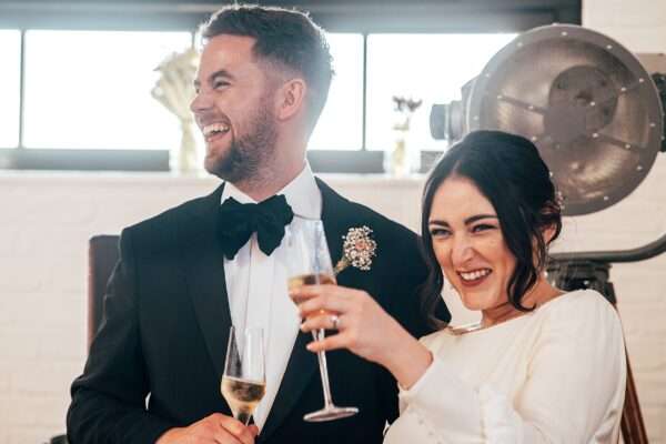 Impossibly chic, black tie wedding at The Hare's Field, with Bridesmaids in mismatched pinks and dried flowers. Best Essex Documentary Wedding Photographer