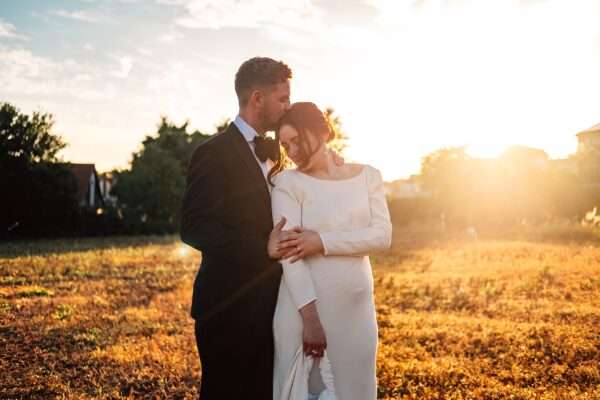 Impossibly chic, black tie wedding at The Hare's Field, with Bridesmaids in mismatched pinks and dried flowers. Best Essex Documentary Wedding Photographer