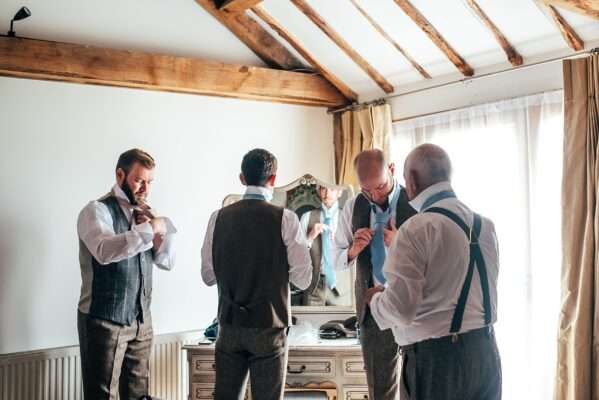 Groom and Groomsmen get ready for Captains Wood Barn Wedding