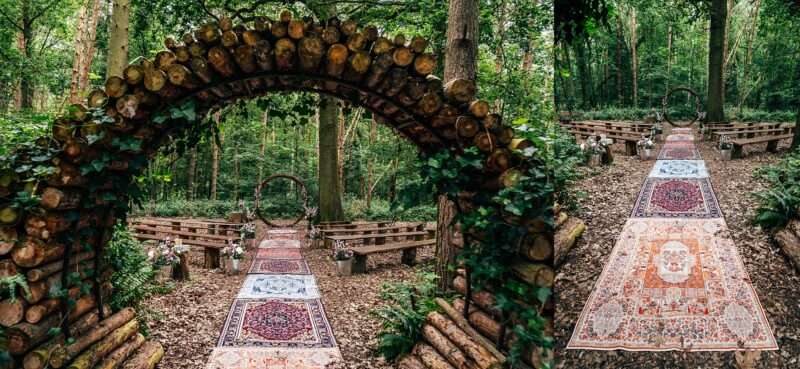 Woodland wedding ceremony set up with Moroccan rugs, wooden benches and woodland flowers at Captains Wood Barn