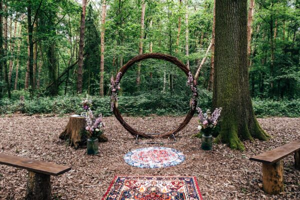 Wicker ceremony circle for woodland wedding at Captains Wood Barn