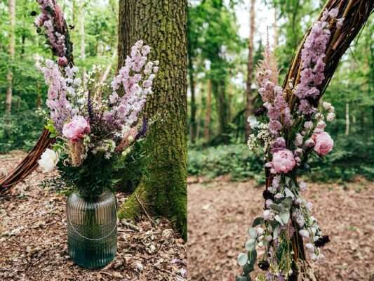 Pinks and purples floral displays for woodland wedding at Captains Wood Barn