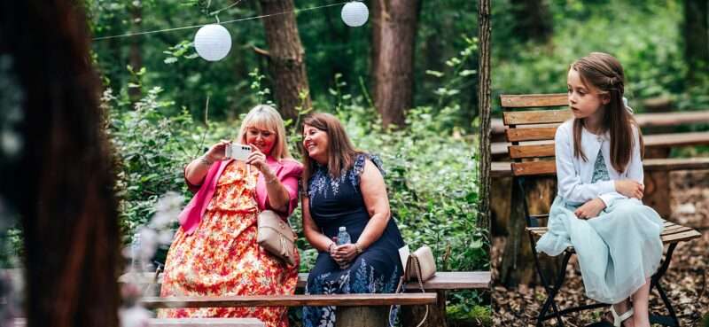 Guests await the bride for woodland wedding at Captains Wood Barn