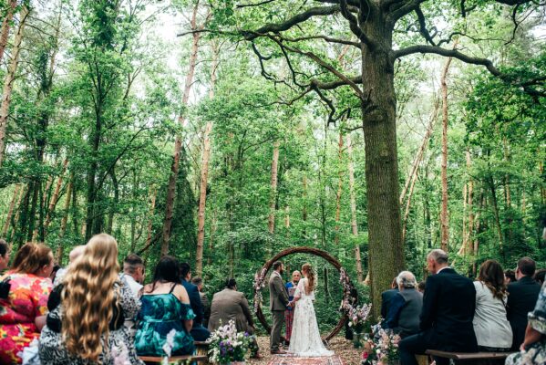 Bride and Groom talk vows during woodland ceremony at Captains Wood Barn