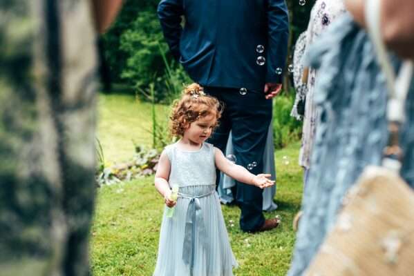 Little girl blows bubbles Captains Wood Barn