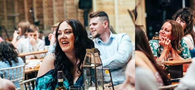 Guests laugh at speeches at Captains Wood Barn Essex documentary wedding photographer