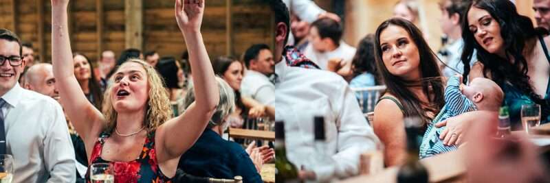 Guests laugh at speeches at Captains Wood Barn Essex documentary wedding photographer