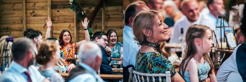 Guests laugh at speeches at Captains Wood Barn Essex documentary wedding photographer