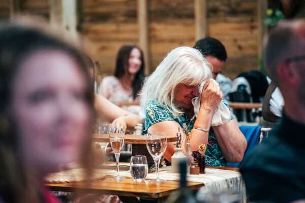 Guest cry at speeches at Captains Wood Barn Essex documentary wedding photographer