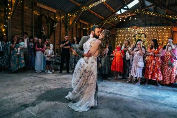 Bride and Groom kiss on dance floor at Captains Wood Barn