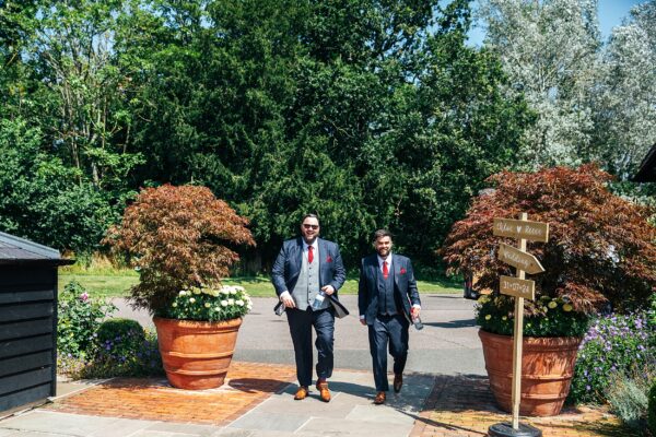 "Rustic barn summer wedding at Blake Hall in Essex with relaxed and happy bride and groom captured in a natural documentary style, perfect for anxious or nervous couples seeking authentic and beautiful wedding photography."