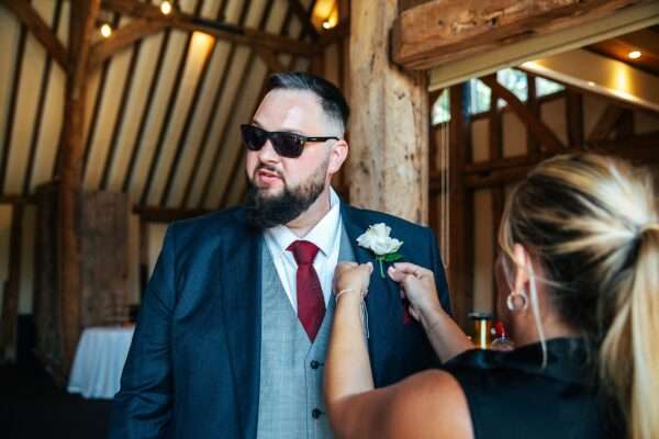 "Rustic barn summer wedding at Blake Hall in Essex with relaxed and happy bride and groom captured in a natural documentary style, perfect for anxious or nervous couples seeking authentic and beautiful wedding photography."