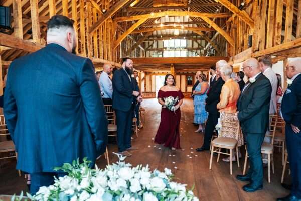 "Rustic barn summer wedding at Blake Hall in Essex with relaxed and happy bride and groom captured in a natural documentary style, perfect for anxious or nervous couples seeking authentic and beautiful wedding photography."