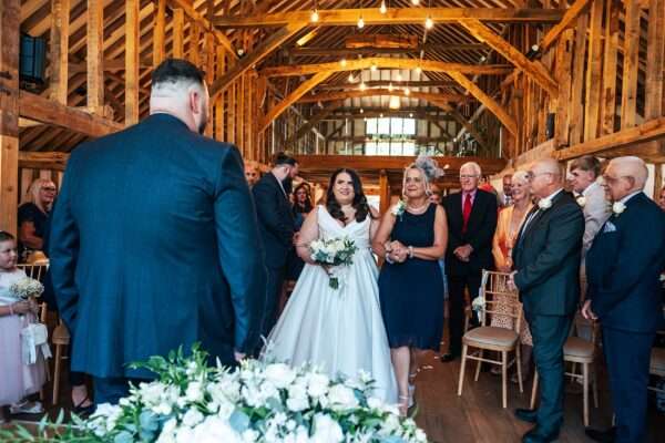 "Rustic barn summer wedding at Blake Hall in Essex with relaxed and happy bride and groom captured in a natural documentary style, perfect for anxious or nervous couples seeking authentic and beautiful wedding photography."