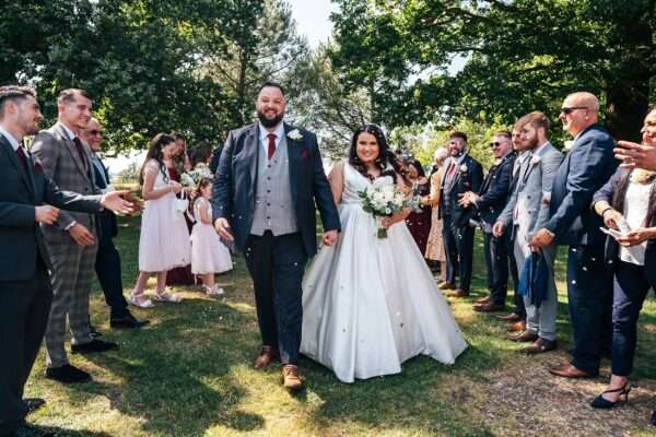 "Rustic barn summer wedding at Blake Hall in Essex with relaxed and happy bride and groom captured in a natural documentary style, perfect for anxious or nervous couples seeking authentic and beautiful wedding photography."