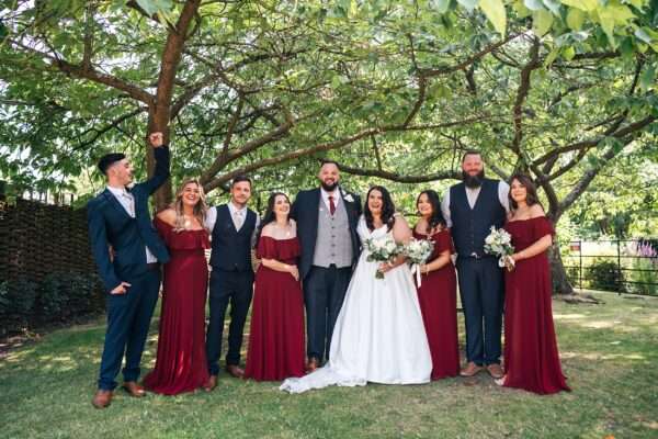 "Rustic barn summer wedding at Blake Hall in Essex with relaxed and happy bride and groom captured in a natural documentary style, perfect for anxious or nervous couples seeking authentic and beautiful wedding photography."