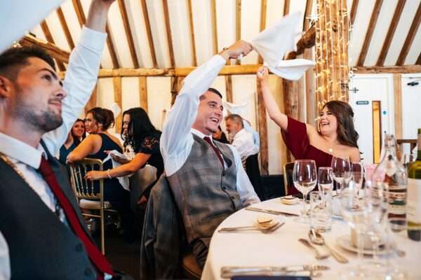 "Rustic barn summer wedding at Blake Hall in Essex with relaxed and happy bride and groom captured in a natural documentary style, perfect for anxious or nervous couples seeking authentic and beautiful wedding photography."