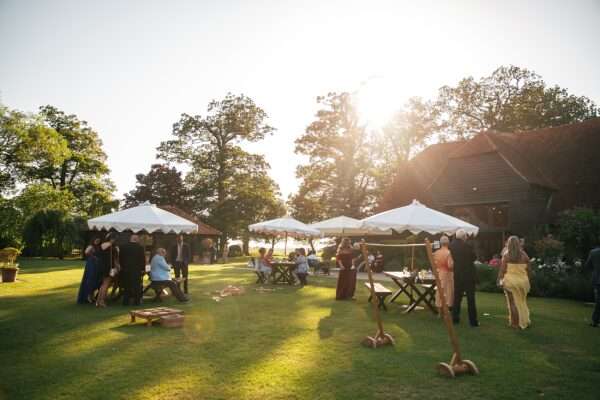 "Rustic barn summer wedding at Blake Hall in Essex with relaxed and happy bride and groom captured in a natural documentary style, perfect for anxious or nervous couples seeking authentic and beautiful wedding photography."