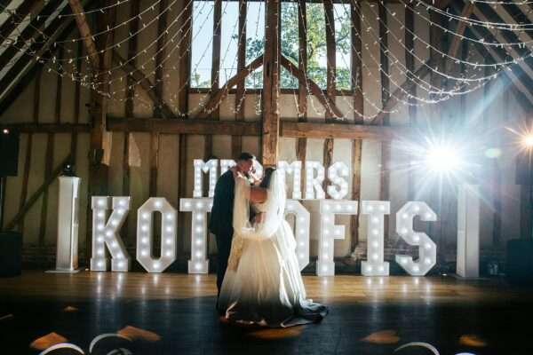 "Rustic barn summer wedding at Blake Hall in Essex with relaxed and happy bride and groom captured in a natural documentary style, perfect for anxious or nervous couples seeking authentic and beautiful wedding photography."