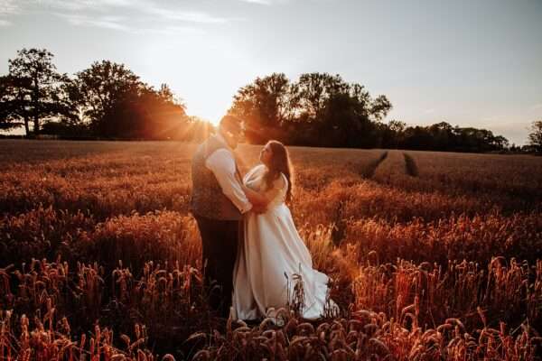 "Rustic barn summer wedding at Blake Hall in Essex with relaxed and happy bride and groom captured in a natural documentary style, perfect for anxious or nervous couples seeking authentic and beautiful wedding photography."