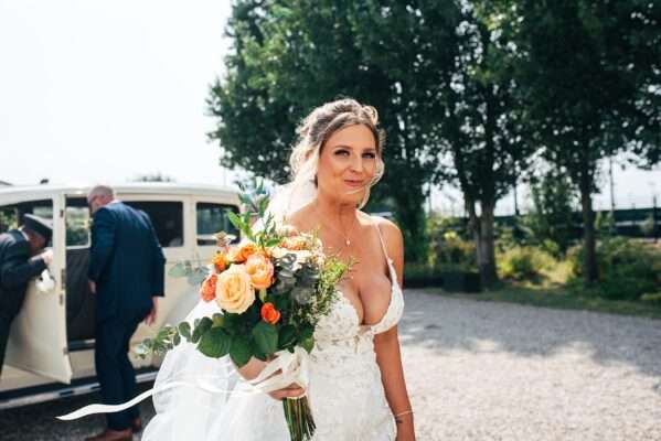 "Outdoor summer wedding at The Boundary in Essex with relaxed and happy bride and groom captured in a natural documentary style, perfect for anxious or nervous couples seeking authentic and beautiful wedding photography."