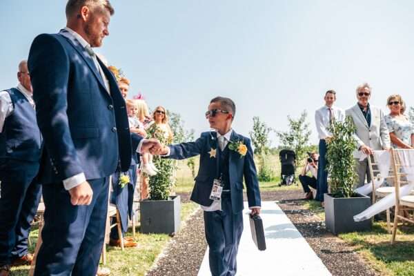 "Outdoor summer wedding at The Boundary in Essex with relaxed and happy bride and groom captured in a natural documentary style, perfect for anxious or nervous couples seeking authentic and beautiful wedding photography."