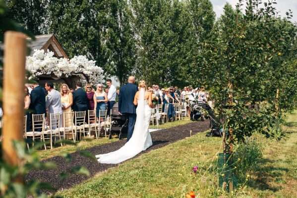 "Outdoor summer wedding at The Boundary in Essex with relaxed and happy bride and groom captured in a natural documentary style, perfect for anxious or nervous couples seeking authentic and beautiful wedding photography."