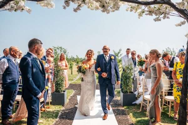 "Outdoor summer wedding at The Boundary in Essex with relaxed and happy bride and groom captured in a natural documentary style, perfect for anxious or nervous couples seeking authentic and beautiful wedding photography."