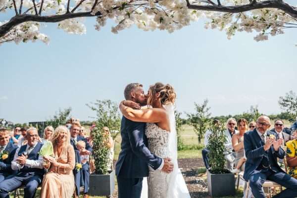 "Outdoor summer wedding at The Boundary in Essex with relaxed and happy bride and groom captured in a natural documentary style, perfect for anxious or nervous couples seeking authentic and beautiful wedding photography."