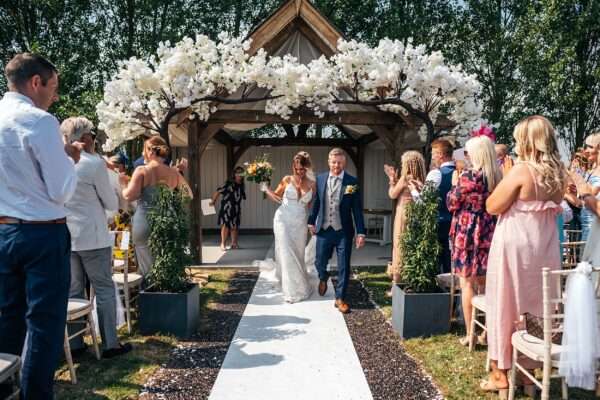 "Outdoor summer wedding at The Boundary in Essex with relaxed and happy bride and groom captured in a natural documentary style, perfect for anxious or nervous couples seeking authentic and beautiful wedding photography."