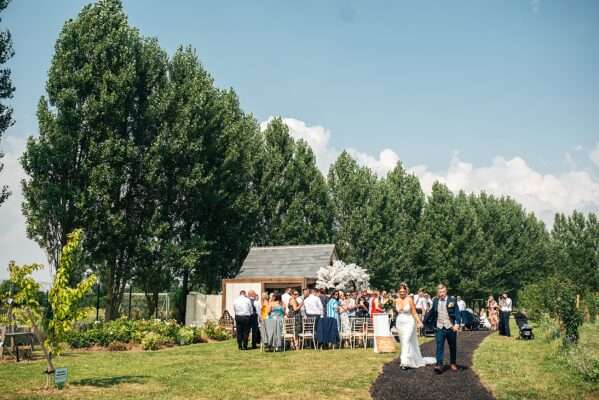 "Outdoor summer wedding at The Boundary in Essex with relaxed and happy bride and groom captured in a natural documentary style, perfect for anxious or nervous couples seeking authentic and beautiful wedding photography."