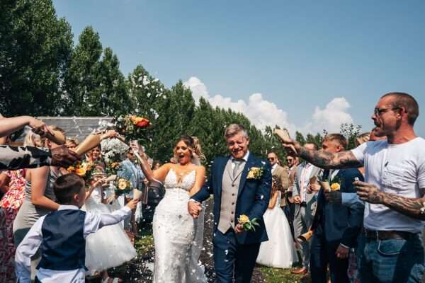 "Outdoor summer wedding at The Boundary in Essex with relaxed and happy bride and groom captured in a natural documentary style, perfect for anxious or nervous couples seeking authentic and beautiful wedding photography."