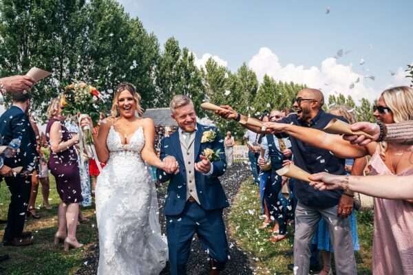 "Outdoor summer wedding at The Boundary in Essex with relaxed and happy bride and groom captured in a natural documentary style, perfect for anxious or nervous couples seeking authentic and beautiful wedding photography."