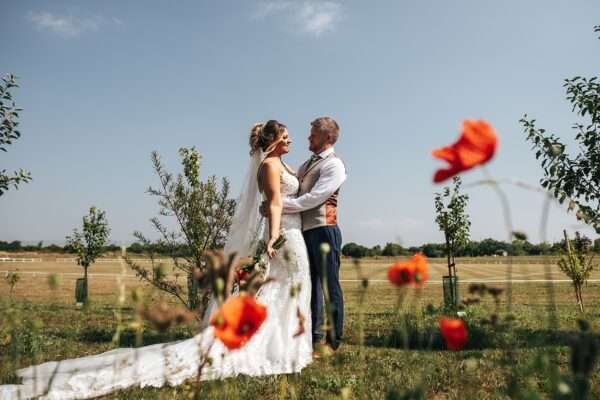 "Outdoor summer wedding at The Boundary in Essex with relaxed and happy bride and groom captured in a natural documentary style, perfect for anxious or nervous couples seeking authentic and beautiful wedding photography."