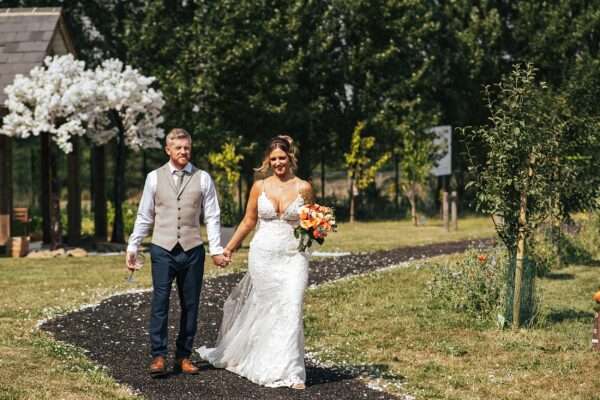 "Outdoor summer wedding at The Boundary in Essex with relaxed and happy bride and groom captured in a natural documentary style, perfect for anxious or nervous couples seeking authentic and beautiful wedding photography."