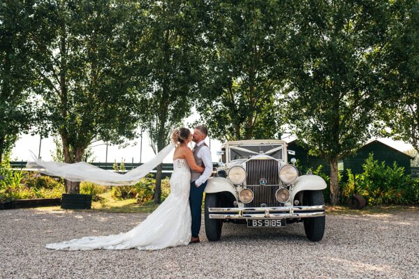 "Outdoor summer wedding at The Boundary in Essex with relaxed and happy bride and groom captured in a natural documentary style, perfect for anxious or nervous couples seeking authentic and beautiful wedding photography."