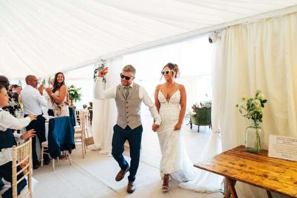 "Outdoor summer wedding at The Boundary in Essex with relaxed and happy bride and groom captured in a natural documentary style, perfect for anxious or nervous couples seeking authentic and beautiful wedding photography."