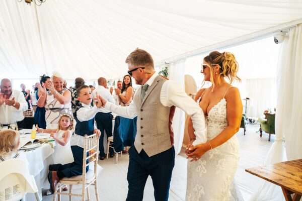 "Outdoor summer wedding at The Boundary in Essex with relaxed and happy bride and groom captured in a natural documentary style, perfect for anxious or nervous couples seeking authentic and beautiful wedding photography."