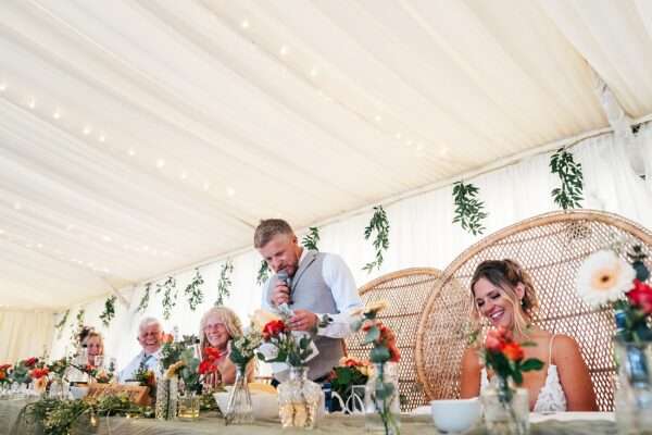 "Outdoor summer wedding at The Boundary in Essex with relaxed and happy bride and groom captured in a natural documentary style, perfect for anxious or nervous couples seeking authentic and beautiful wedding photography."