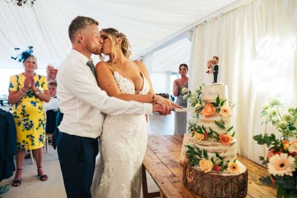 "Outdoor summer wedding at The Boundary in Essex with relaxed and happy bride and groom captured in a natural documentary style, perfect for anxious or nervous couples seeking authentic and beautiful wedding photography."