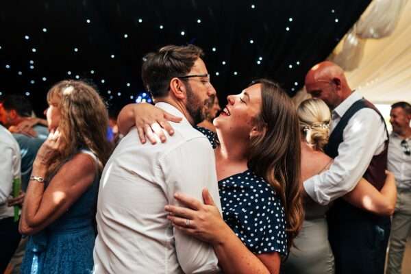 "Outdoor summer wedding at The Boundary in Essex with relaxed and happy bride and groom captured in a natural documentary style, perfect for anxious or nervous couples seeking authentic and beautiful wedding photography."