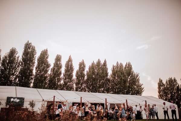 "Outdoor summer wedding at The Boundary in Essex with relaxed and happy bride and groom captured in a natural documentary style, perfect for anxious or nervous couples seeking authentic and beautiful wedding photography."