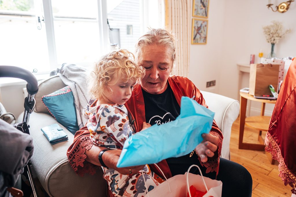 Brides Mum helps granddaughter open gift