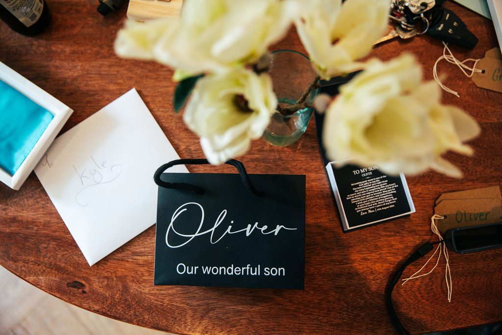 Close up's of gifts on table in Groom prep