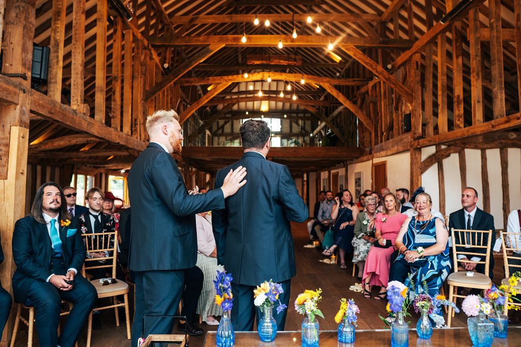 Best Man gives Groom reassuring pat on the back