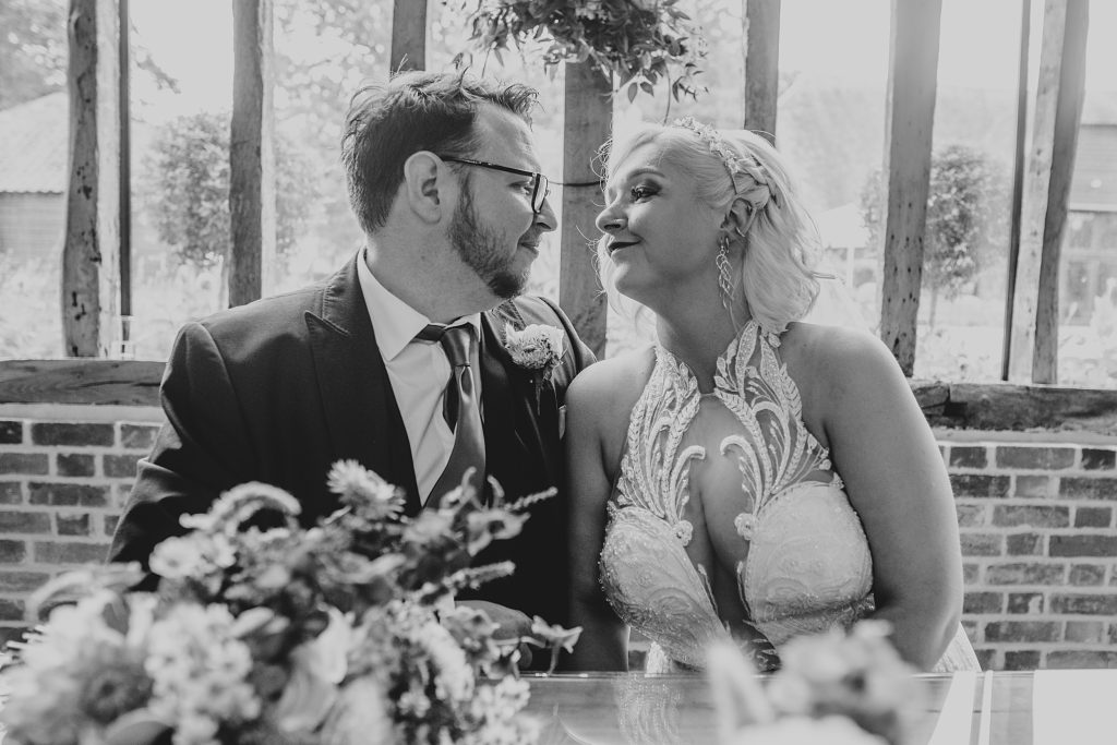 bride and groom sit together after ceremony