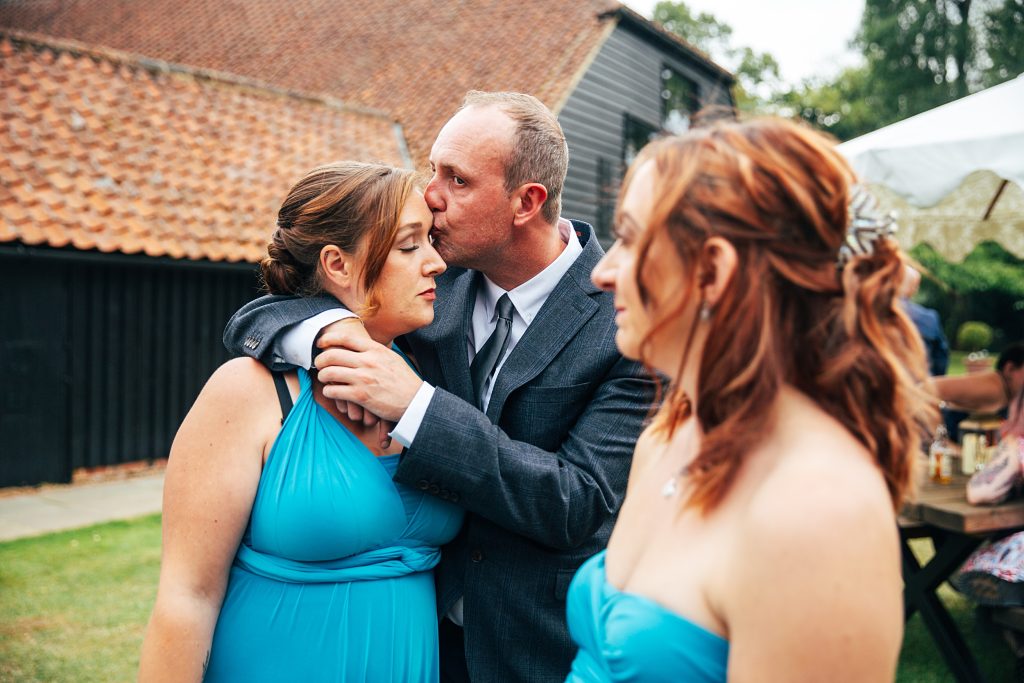 guests kiss during reception
