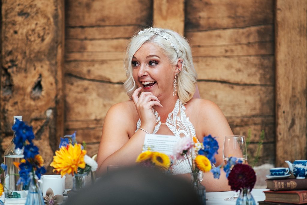 bride looks surprised during speeches