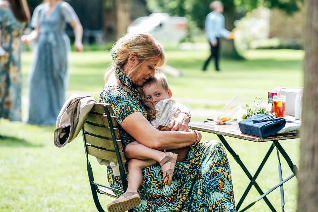 woman hugs child