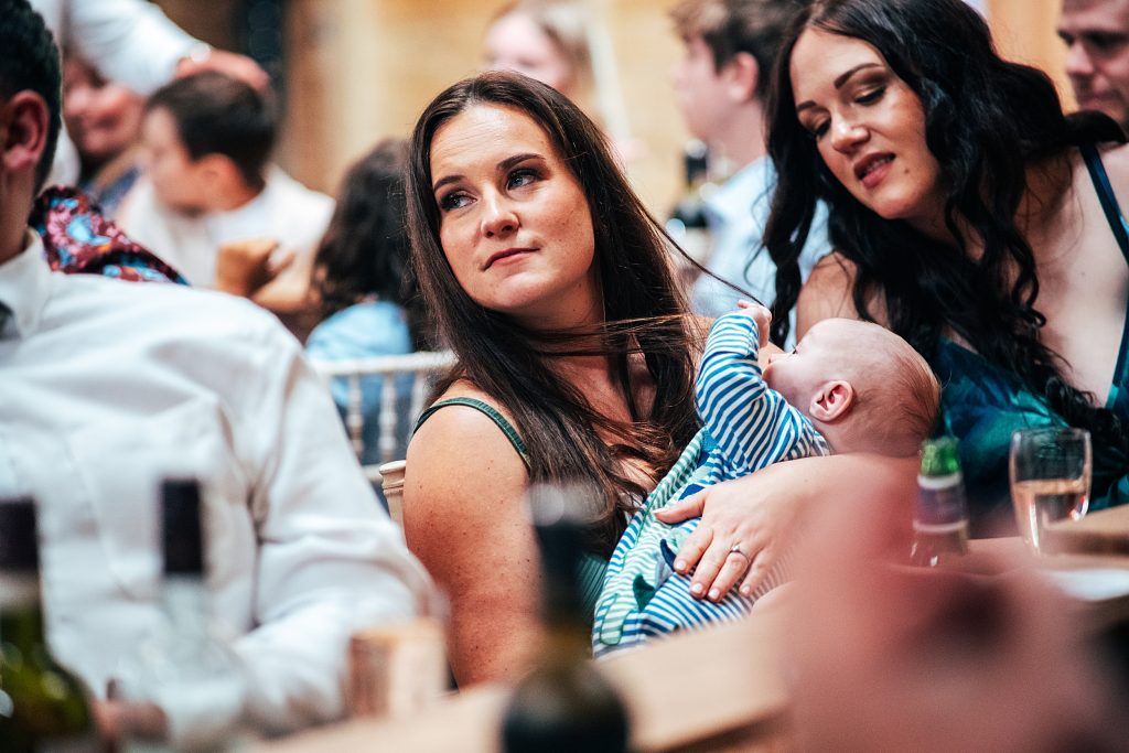 baby plays with mums hair during wedding speeches